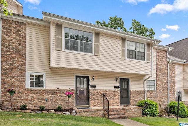 view of property with brick siding