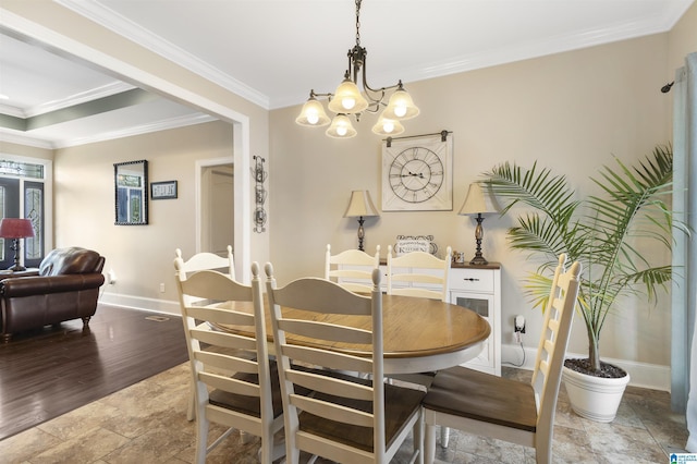 1018 Sheraton Rd SW, Cullman, AL 35055 - dining area with an inviting chandelier, baseboards, crown molding, and stone tile floors