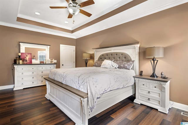 1018 Sheraton Rd SW, Cullman, AL 35055 - bedroom with baseboards, ornamental molding, a tray ceiling, recessed lighting, and dark wood-type flooring
