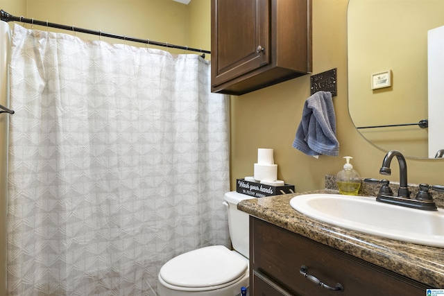 1018 Sheraton Rd SW, Cullman, AL 35055 - bathroom featuring vanity, a shower with shower curtain, and toilet