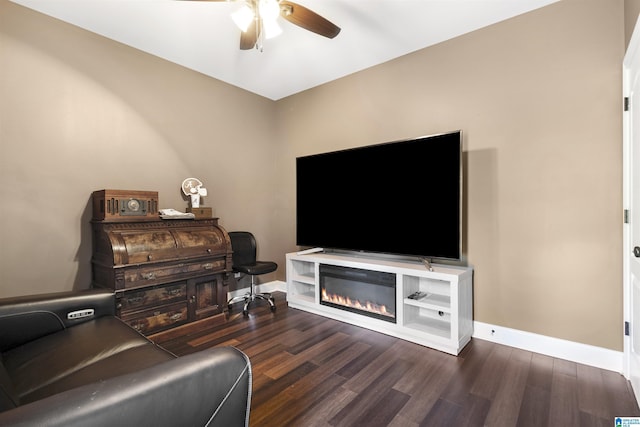 1018 Sheraton Rd SW, Cullman, AL 35055 - living room with baseboards, ceiling fan, a glass covered fireplace, and wood finished floors