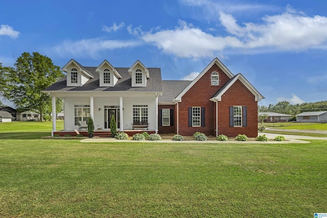 1018 Sheraton Rd SW, Cullman, AL 35055 - new england style home with brick siding, a shingled roof, covered porch, and a front yard