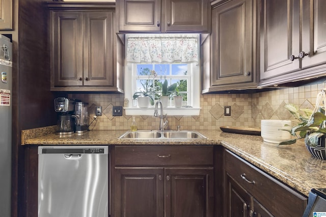 1018 Sheraton Rd SW, Cullman, AL 35055 - kitchen with backsplash, dark brown cabinets, a sink, and dishwasher