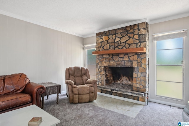 carpeted living room featuring ornamental molding, a fireplace, and a textured ceiling