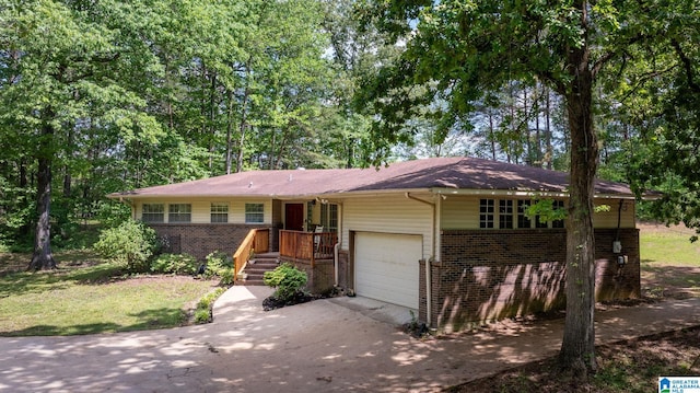 single story home featuring brick siding and driveway