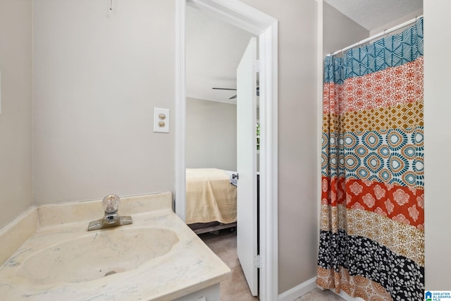 ensuite bathroom with a shower with curtain, a sink, and ensuite bath