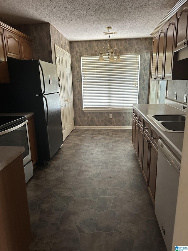 kitchen with a chandelier, a textured ceiling, dishwasher, electric stove, and wallpapered walls