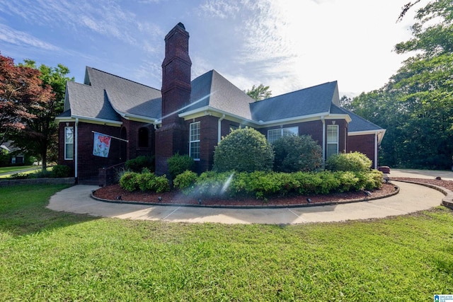 166 Hickory Ridge Dr, Glencoe, AL 35905 - view of front facade with brick siding, a front yard, a chimney, and roof with shingles
