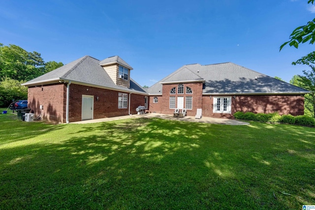 166 Hickory Ridge Dr, Glencoe, AL 35905 - rear view of house with french doors, a patio, brick siding, and a lawn
