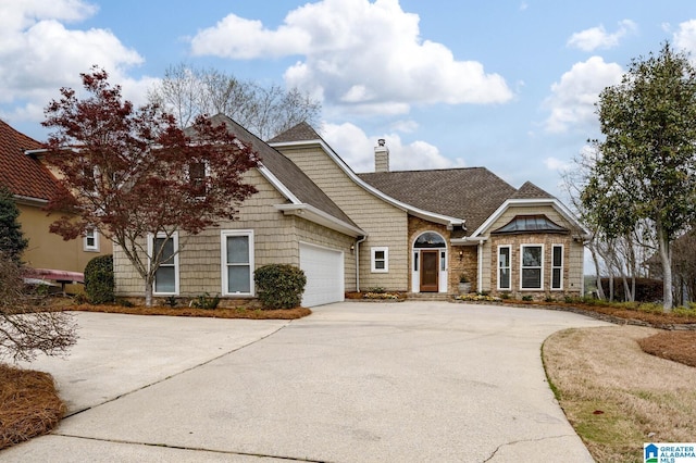 view of front of property featuring a chimney, driveway, a shingled roof, and an attached garage