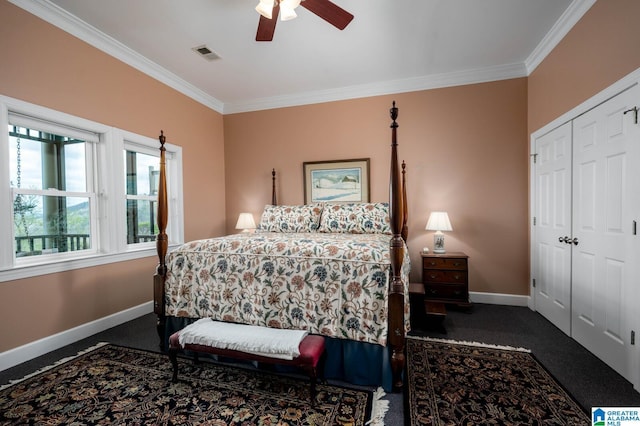 carpeted bedroom featuring crown molding, visible vents, baseboards, and a closet