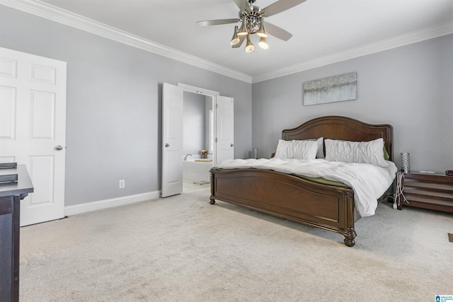 bedroom with crown molding, carpet flooring, connected bathroom, a ceiling fan, and baseboards