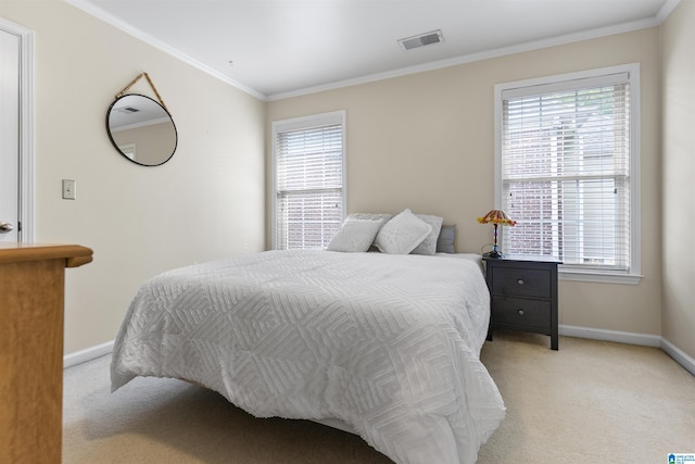 bedroom with baseboards, multiple windows, and light carpet