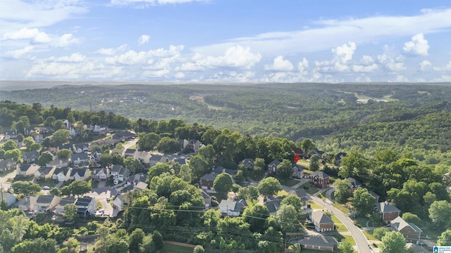 birds eye view of property with a wooded view