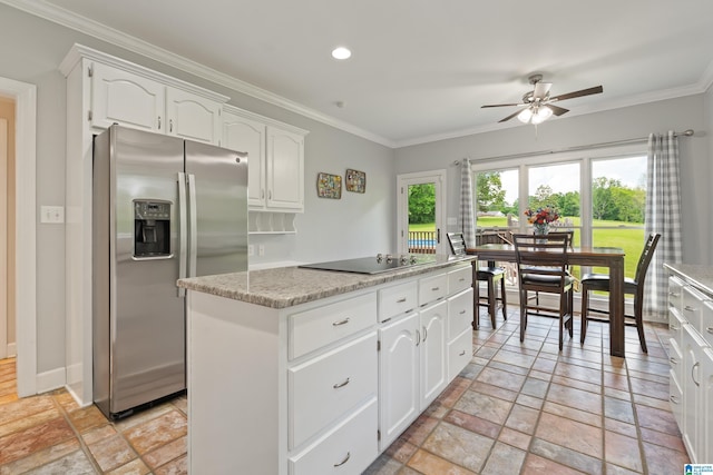 kitchen with ceiling fan, a kitchen island, black electric cooktop, stainless steel fridge with ice dispenser, and ornamental molding