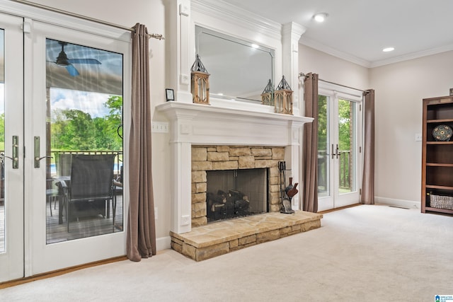carpeted living room with a stone fireplace, french doors, recessed lighting, baseboards, and ornamental molding