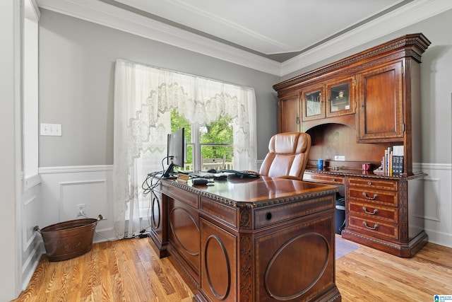 office space featuring ornamental molding, wainscoting, and light wood finished floors