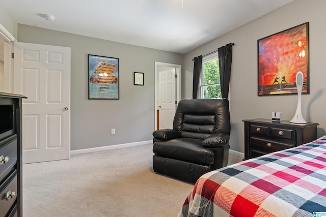 bedroom with baseboards and carpet