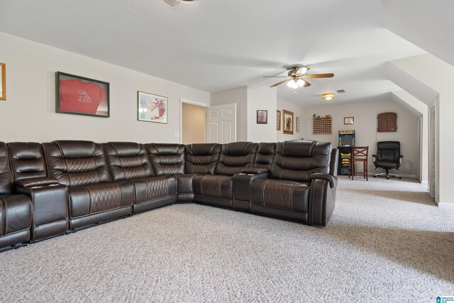 living area with a ceiling fan and carpet