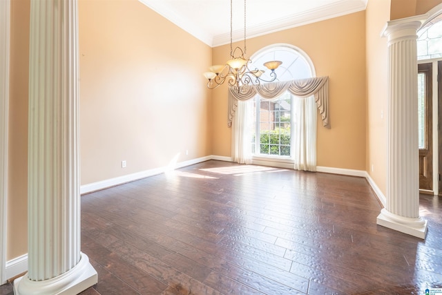 306 Oak Leaf Ln, Glencoe, AL 35905 - spare room with a notable chandelier, wood-type flooring, baseboards, ornate columns, and ornamental molding
