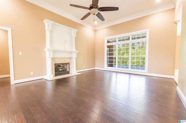 306 Oak Leaf Ln, Glencoe, AL 35905 - unfurnished living room featuring ceiling fan, a tiled fireplace, baseboards, ornamental molding, and hardwood / wood-style flooring