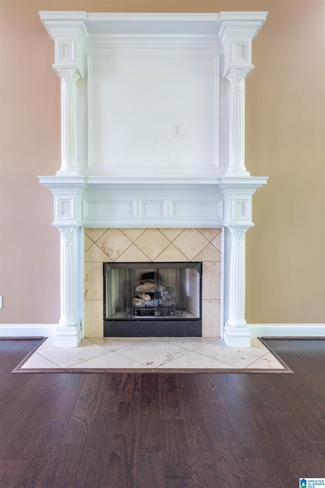 306 Oak Leaf Ln, Glencoe, AL 35905 - room details with baseboards, a high end fireplace, and wood finished floors