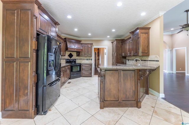 306 Oak Leaf Ln, Glencoe, AL 35905 - kitchen featuring premium range hood, decorative backsplash, black appliances, and a peninsula