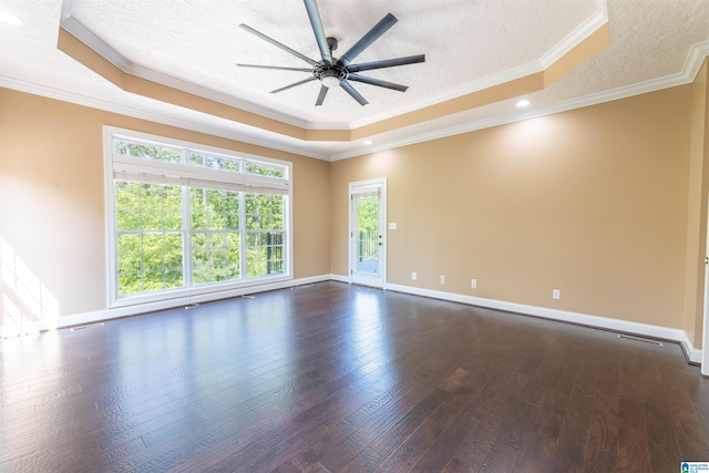 306 Oak Leaf Ln, Glencoe, AL 35905 - empty room featuring a ceiling fan, a textured ceiling, dark wood-style floors, ornamental molding, and a tray ceiling