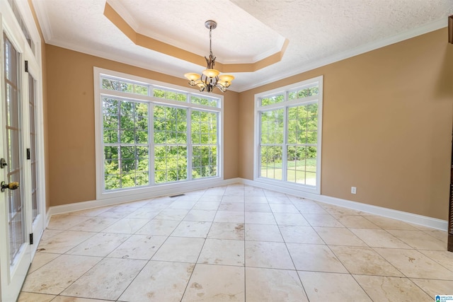 306 Oak Leaf Ln, Glencoe, AL 35905 - unfurnished room featuring a textured ceiling, a chandelier, ornamental molding, and a raised ceiling