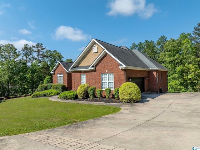 306 Oak Leaf Ln, Glencoe, AL 35905 - view of front of house with a garage, concrete driveway, a front lawn, and brick siding