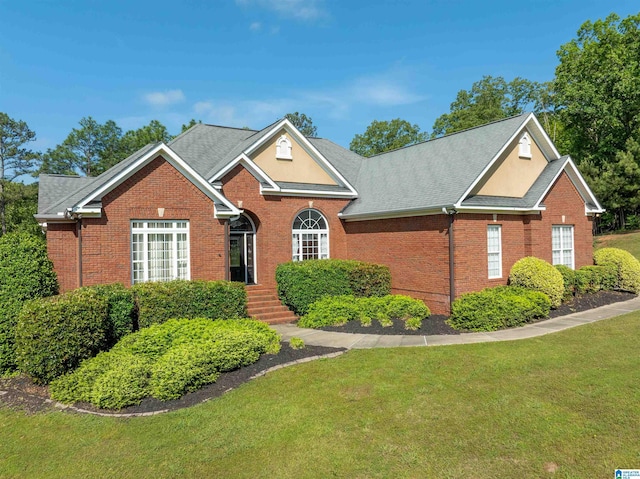 306 Oak Leaf Ln, Glencoe, AL 35905 - view of front facade with brick siding, a shingled roof, and a front lawn