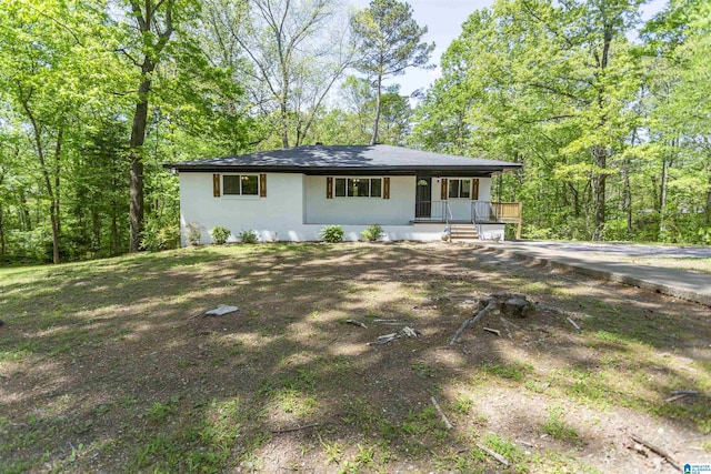 view of front of home featuring stucco siding and a porch