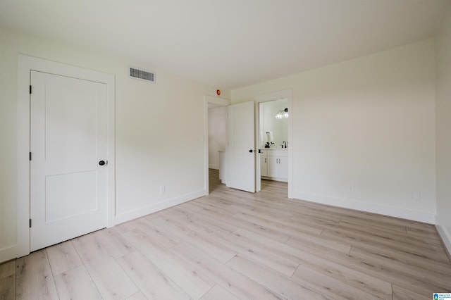 3101 Lorna Rd Unit 1626, Hoover, AL 35216 - unfurnished bedroom with light wood-style floors and ensuite bathroom
