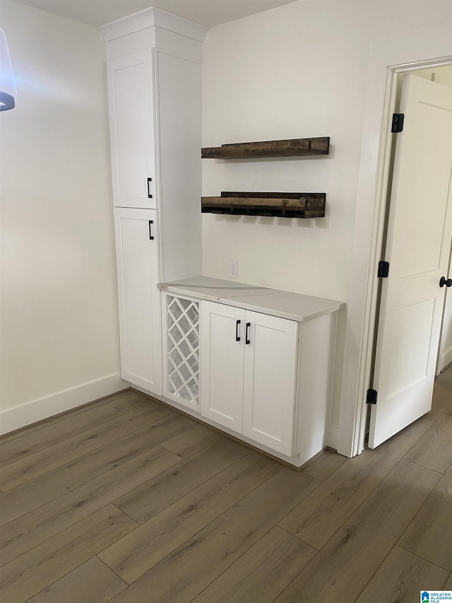 3101 Lorna Rd Unit 1626, Hoover, AL 35216 - bar area featuring dark wood finished floors and baseboards