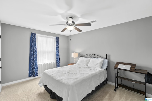 bedroom featuring baseboards, carpet, and a ceiling fan