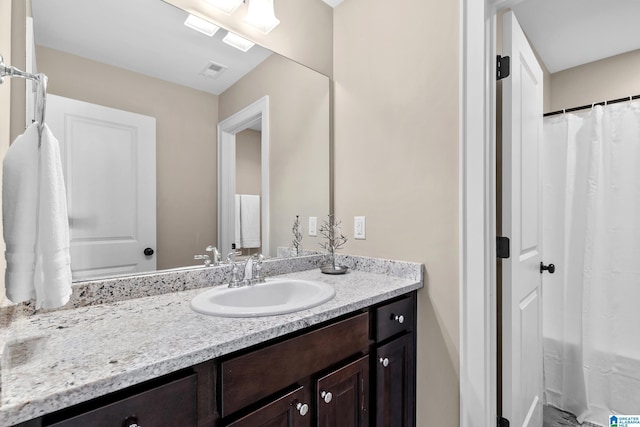 bathroom with visible vents and vanity