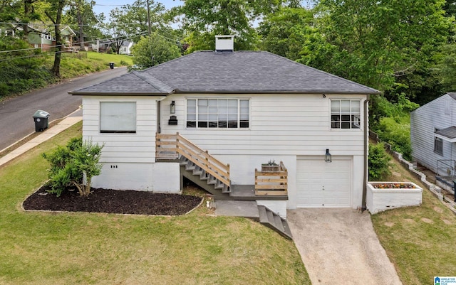 view of front facade featuring an attached garage, roof with shingles, concrete driveway, and a front lawn