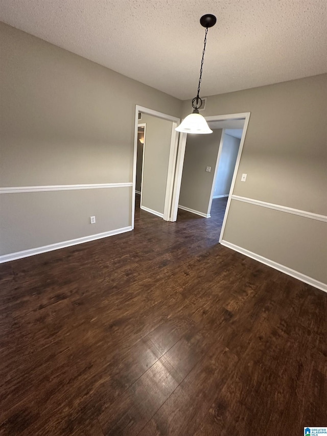 2003 Patton Creek Dr Unit 2003, Hoover, AL 35226 - unfurnished dining area with dark wood-type flooring, a textured ceiling, and baseboards