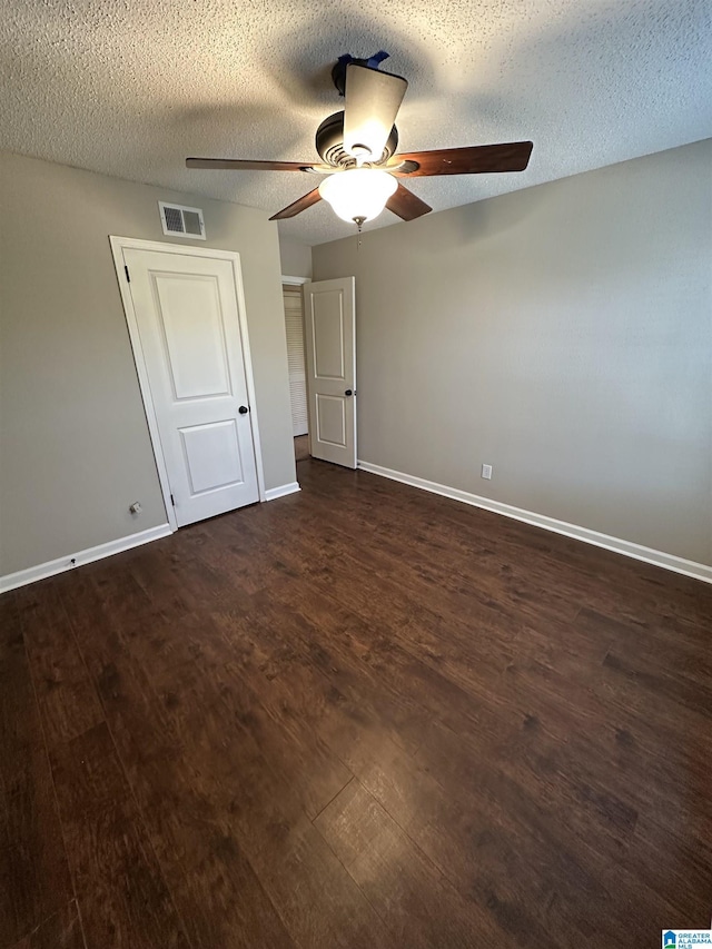 2003 Patton Creek Dr Unit 2003, Hoover, AL 35226 - unfurnished bedroom with a ceiling fan, a textured ceiling, visible vents, baseboards, and dark wood-type flooring