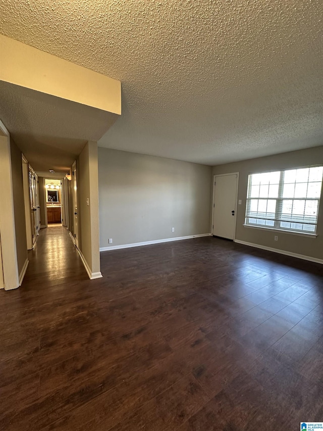2003 Patton Creek Dr Unit 2003, Hoover, AL 35226 - unfurnished room with a textured ceiling, dark wood finished floors, and baseboards