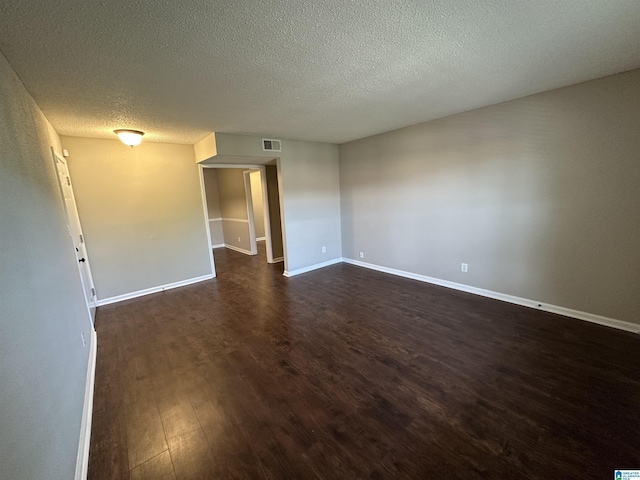 2003 Patton Creek Dr Unit 2003, Hoover, AL 35226 - spare room featuring baseboards, dark wood finished floors, a textured ceiling, and visible vents