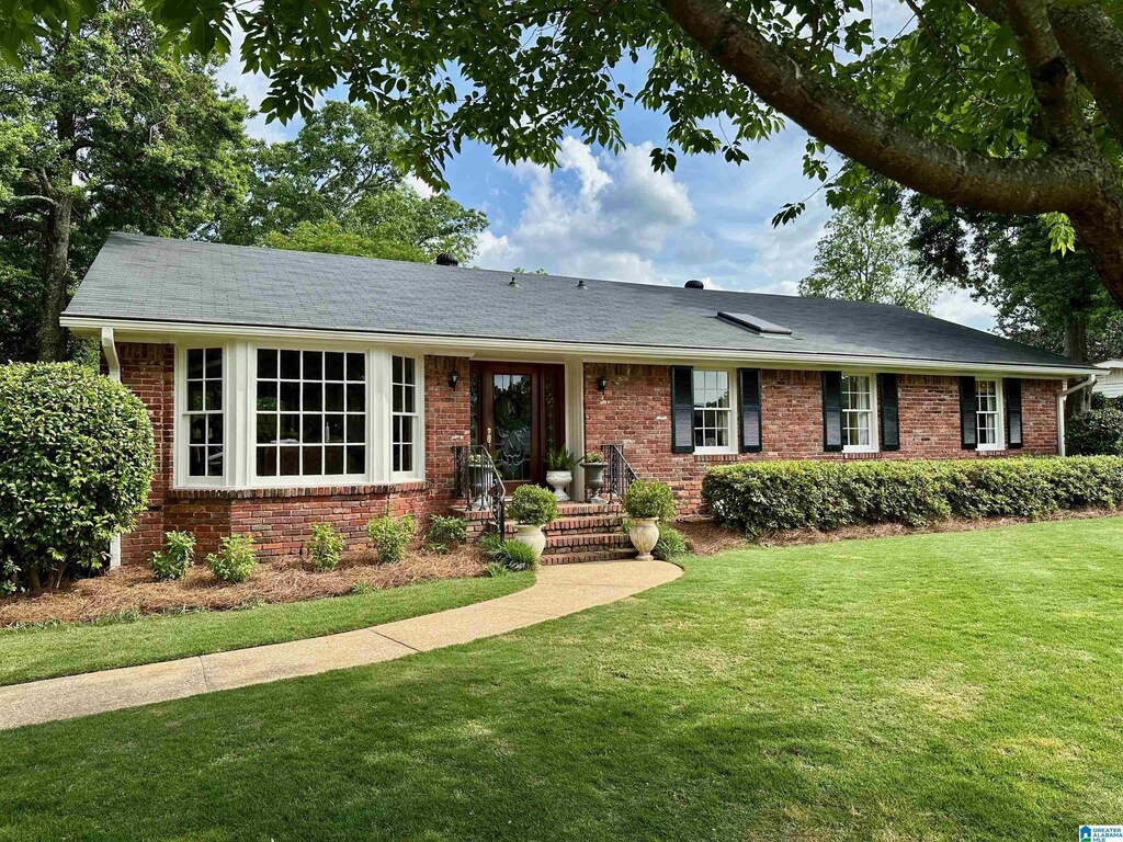 1849 Indian Hill Rd, Vestavia Hills, AL 35216 - ranch-style house with brick siding and a front lawn