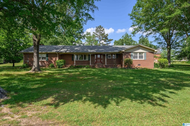 single story home with a front yard and brick siding