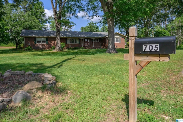 single story home featuring a front yard