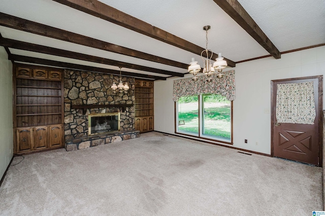 unfurnished living room with visible vents, a fireplace, beamed ceiling, a notable chandelier, and carpet flooring