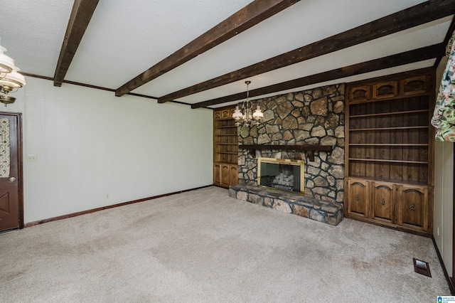 unfurnished living room featuring a notable chandelier, beam ceiling, carpet, baseboards, and visible vents