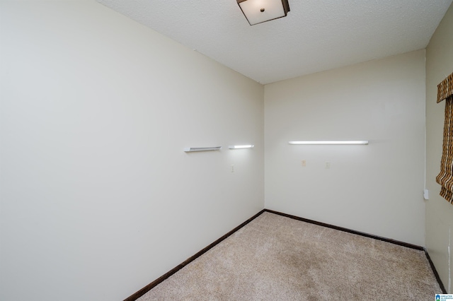 spare room with carpet floors and baseboards