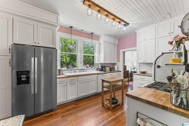 kitchen with dark wood-style flooring, stainless steel fridge with ice dispenser, dishwasher, butcher block countertops, and decorative backsplash