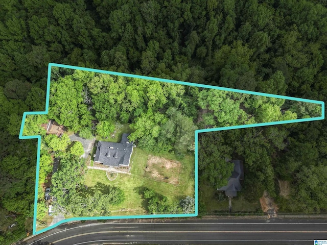 aerial view featuring a view of trees