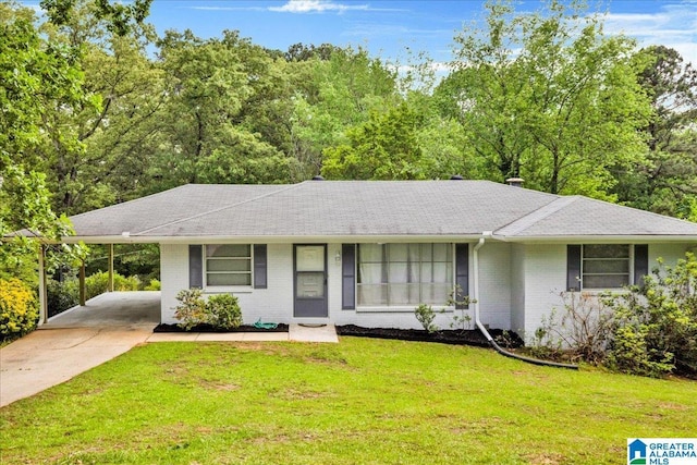 single story home featuring roof with shingles, brick siding, a front yard, concrete driveway, and a carport